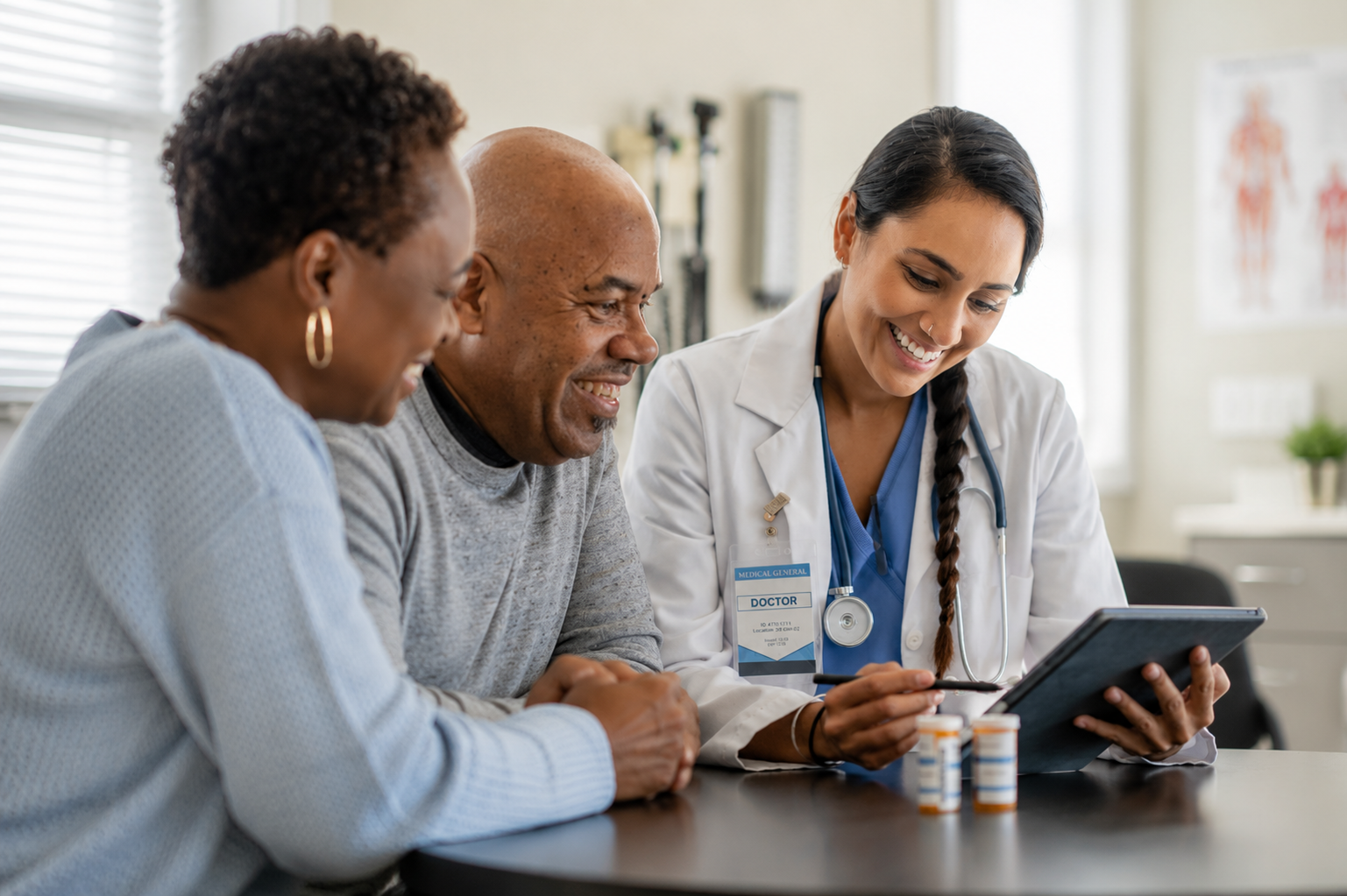 A doctor reviewing results on a tablet with an older couple